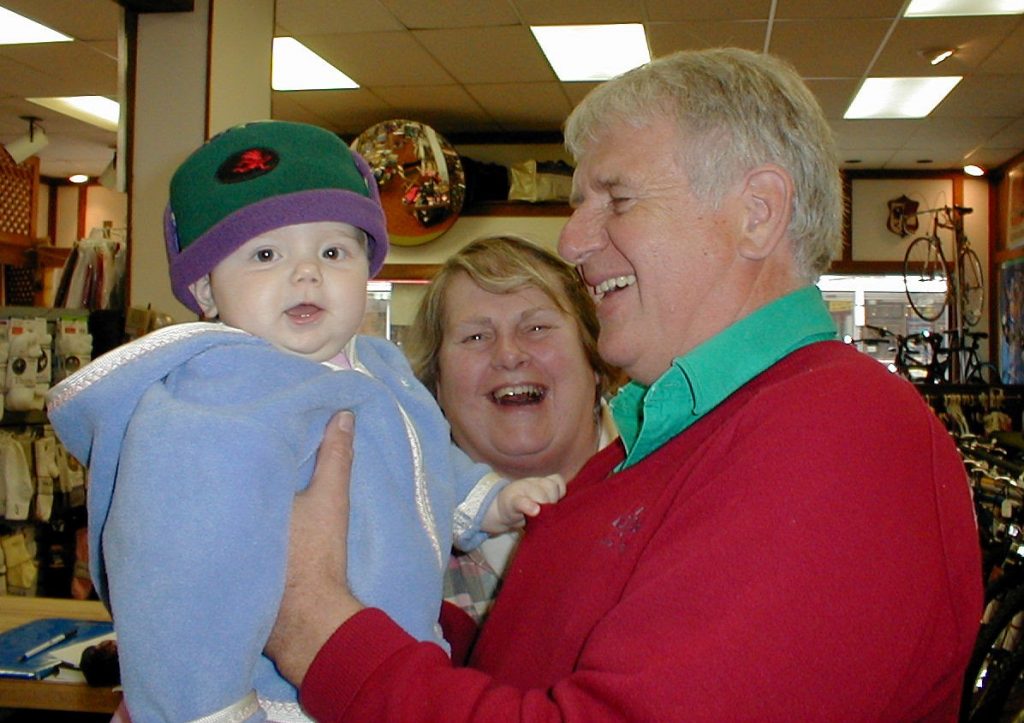 Ed and Ingrid with their first grandchild in the 150 Main St. location.