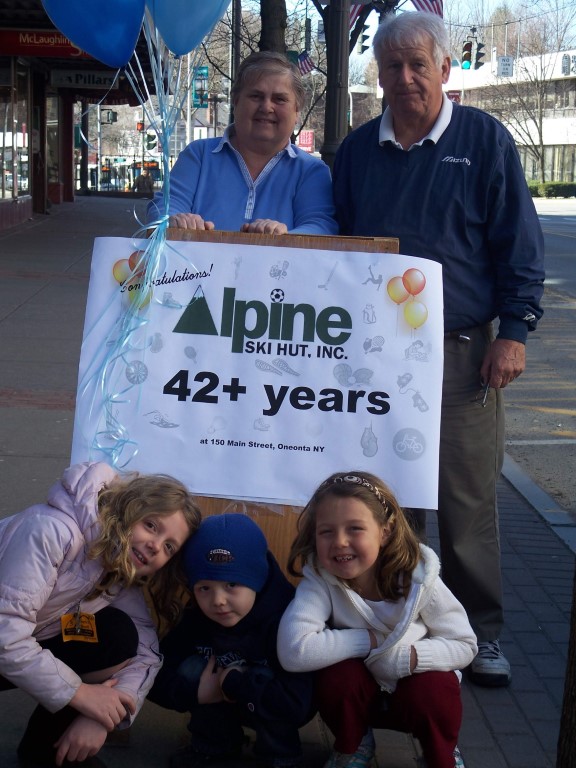 Ingrid, Ed and grandchildren in front of 150 Main Street location.